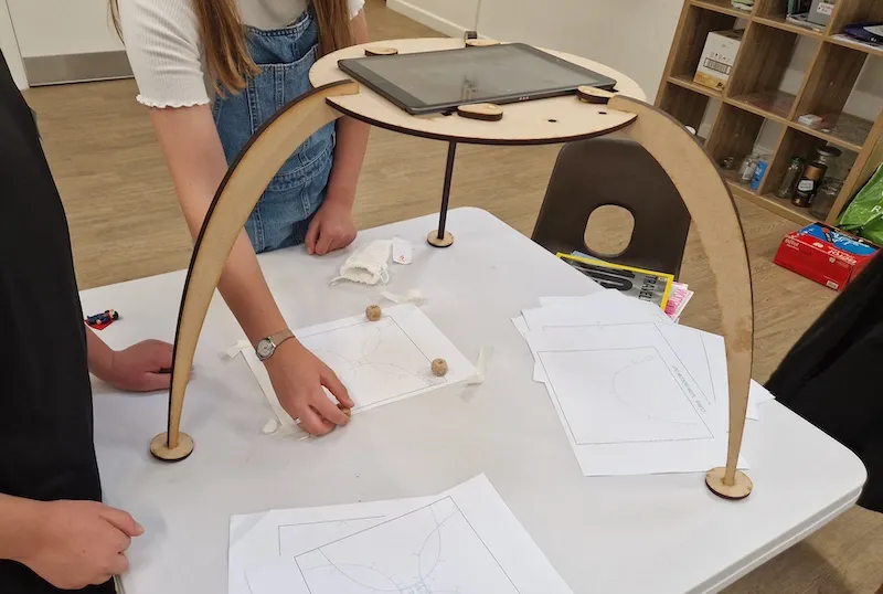Young people making stop-motion animations with a specially made rostrum
