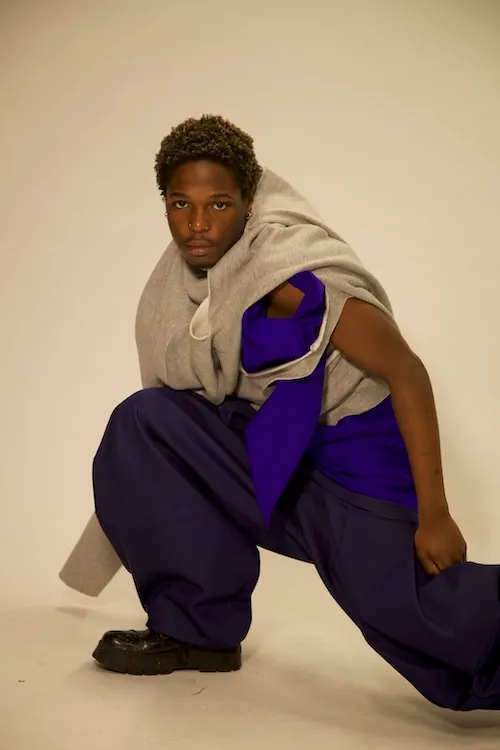 A model wearing clothing designed by Zeshaan Iqbal for his UCA final major project