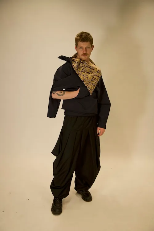 A model wearing clothing designed by Zeshaan Iqbal for his UCA final major project