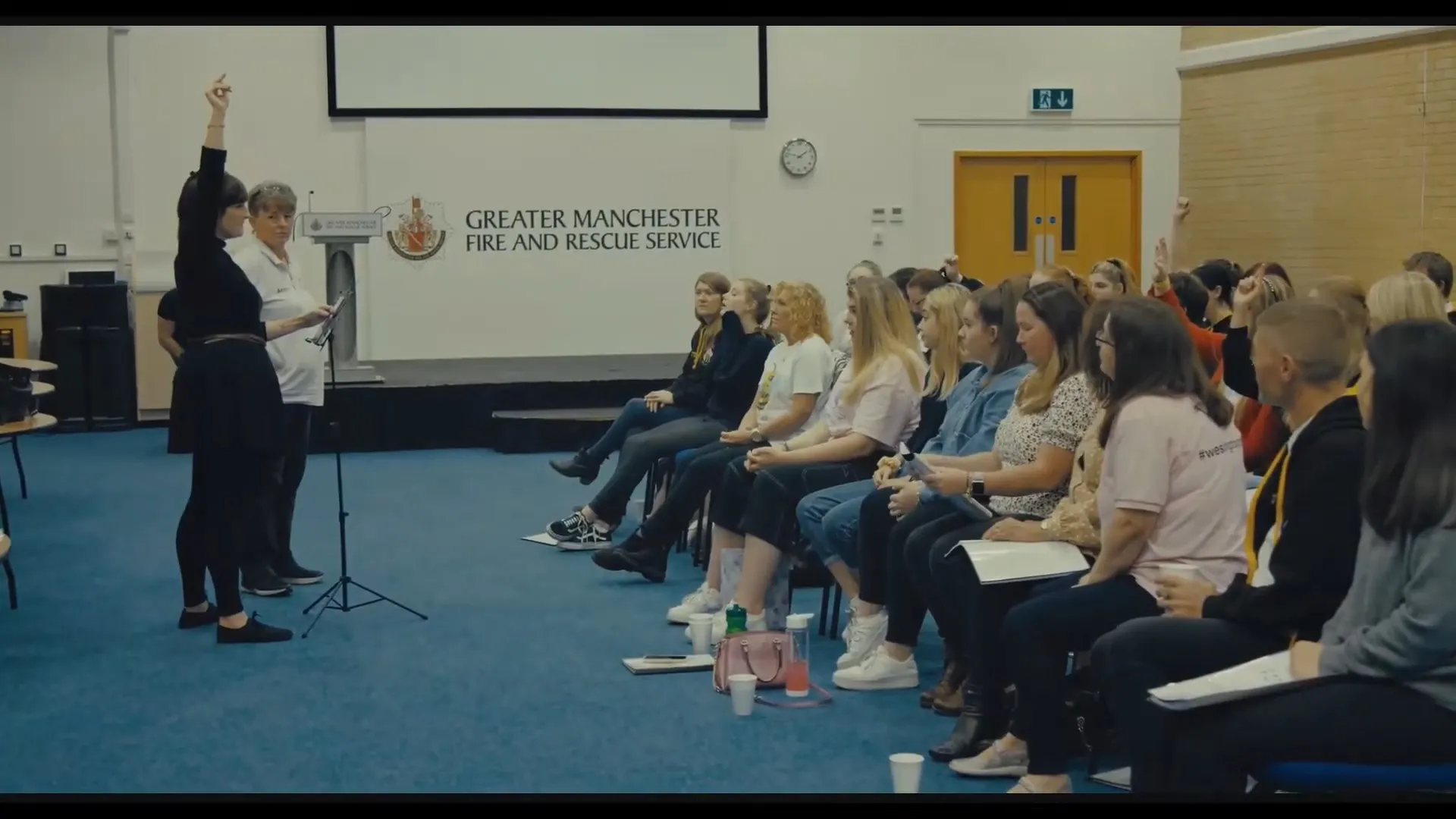 A choir practicing - a scene from A Manchester Story