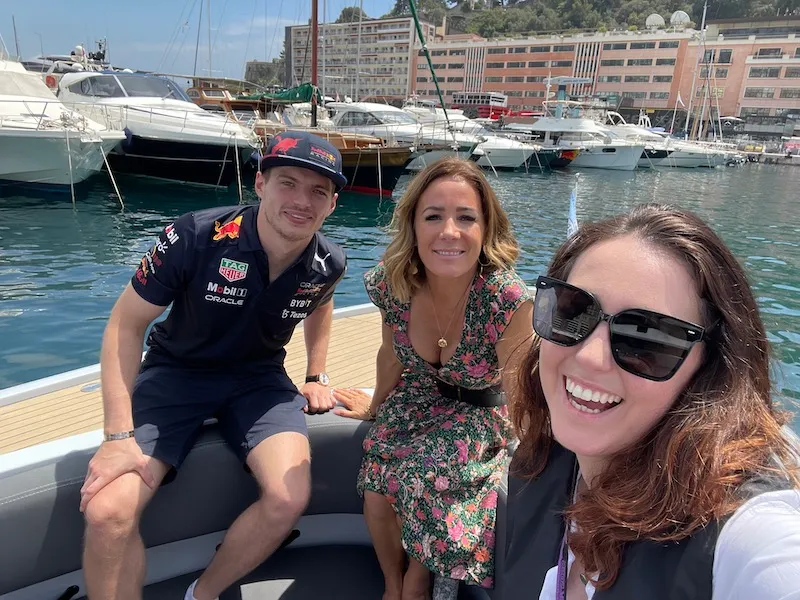 Image shows Formula 1 2021 World Champion Max Verstappen, presenter Natalie Pinkham and Georgina Sadler in Monaco