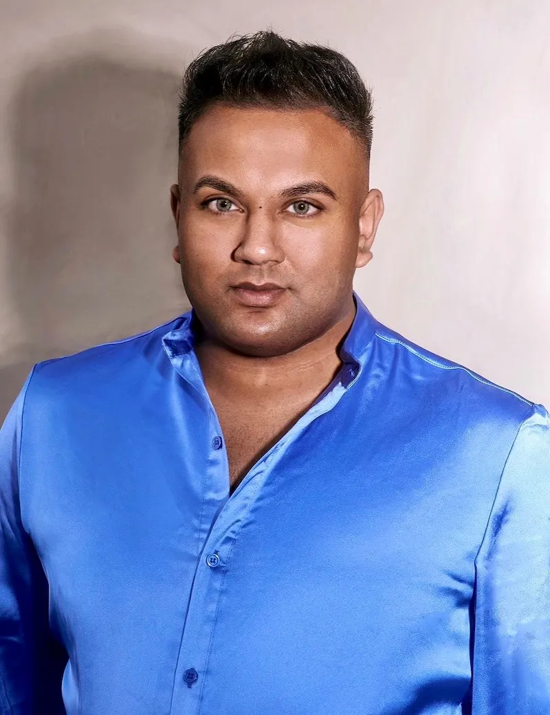 Headshot of UCA graduate Jay Thapar, wearing a blue shirt