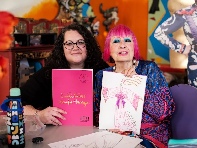 Zandra Rhodes, right, and Ellen Brown with the Sketchbook created for Colourful Heritage