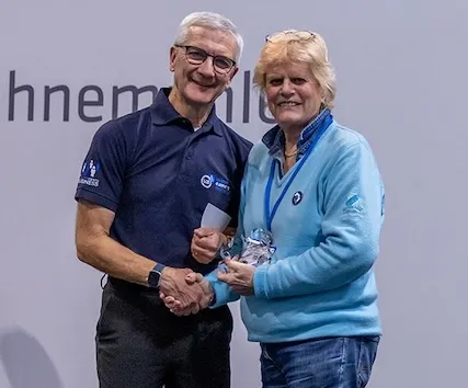 Marilyn Taylor, right, receiving her prize from a representative of the London Camera Exchange