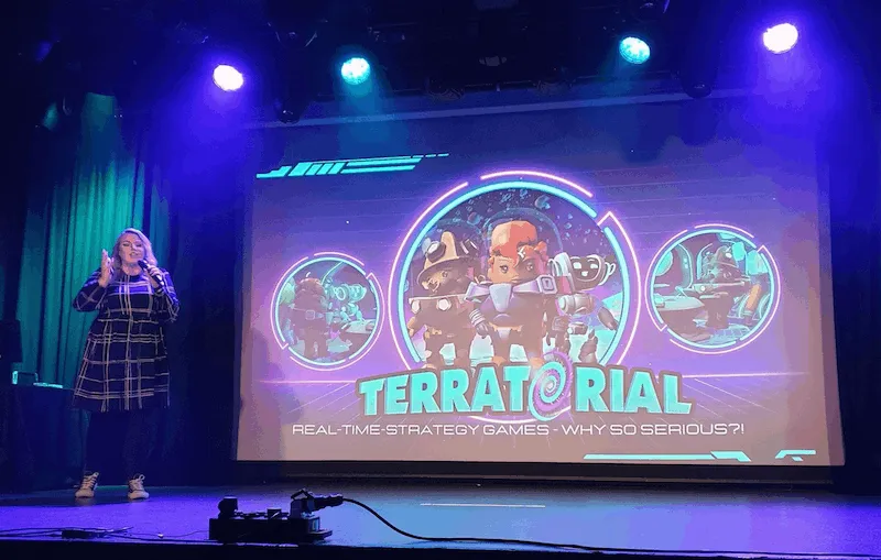 Sally Sheppard speaks on stage at the launch of a game