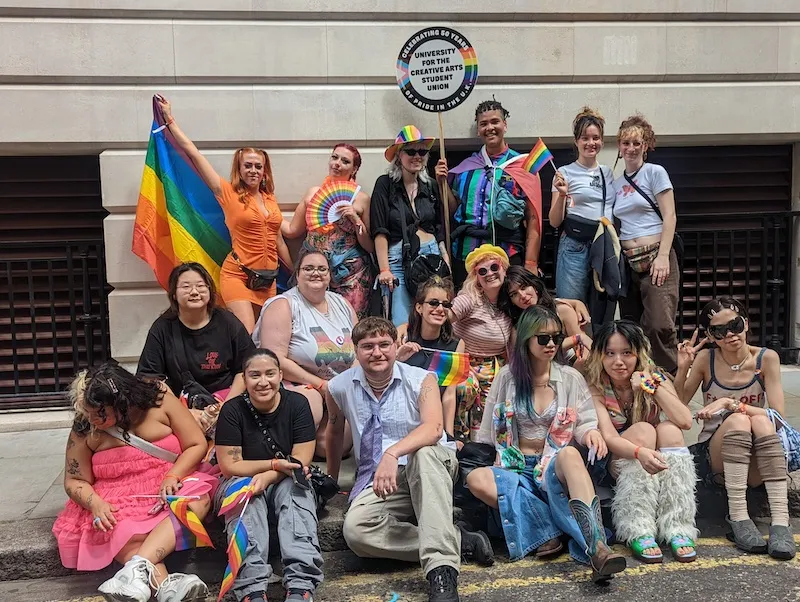 A group of UCA students dressed in the rainbow Pride colours for the Pride parade in London in 2022