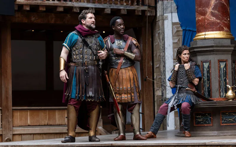 UCA acting and performance alumni Gabin Kongolo, right, on stage at Shakespeare's Globe