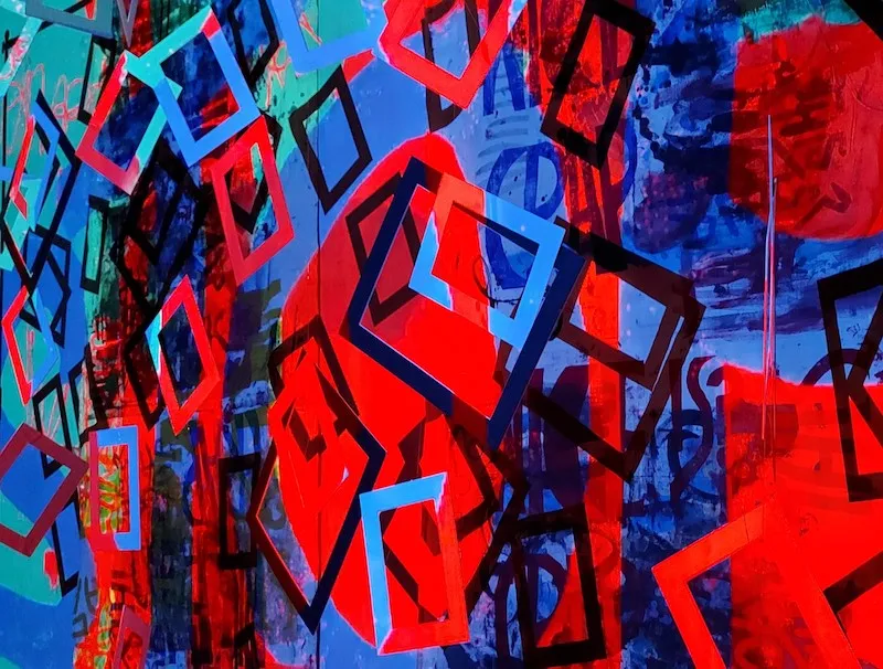 A vibrant piece of art by Vicki Salmi, comprising abstract shapes in red and blue