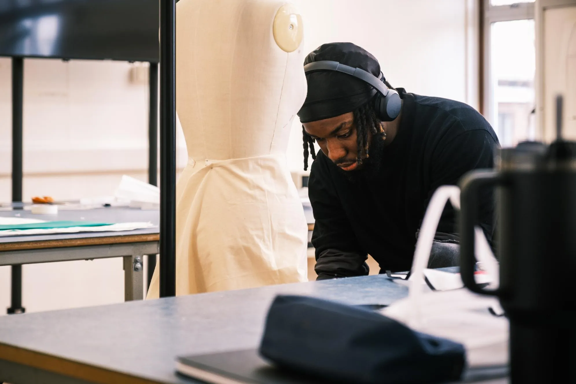 Student working in a fashion design studio
