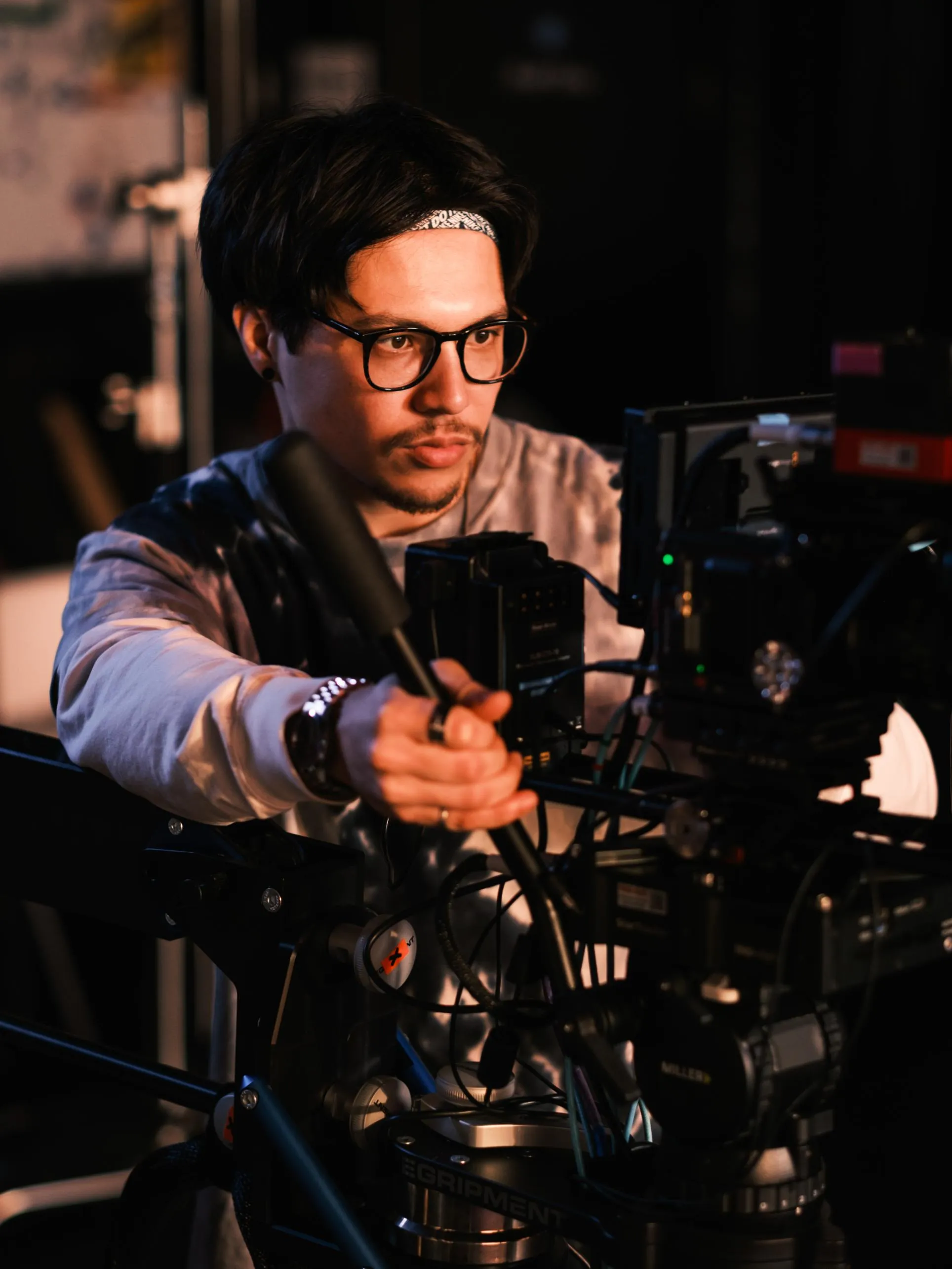Student working a camera in a film studio