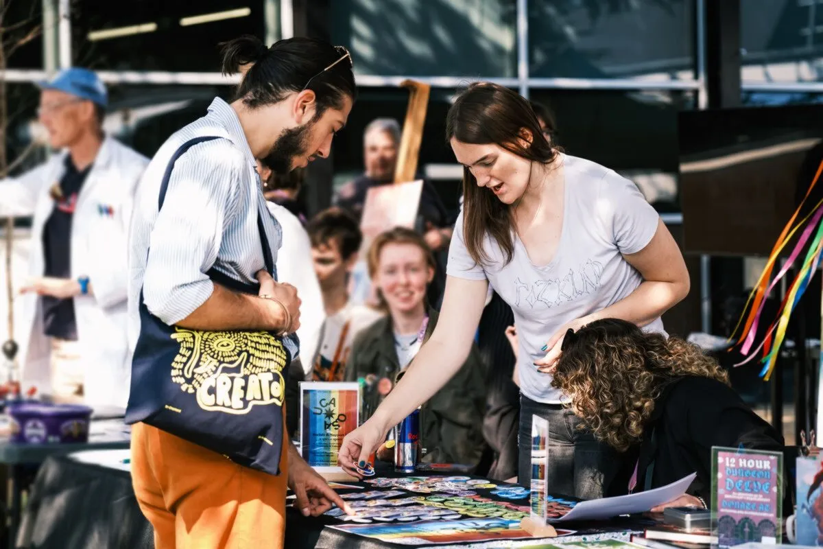 Students looking at a market stall at the Freshers' Fair