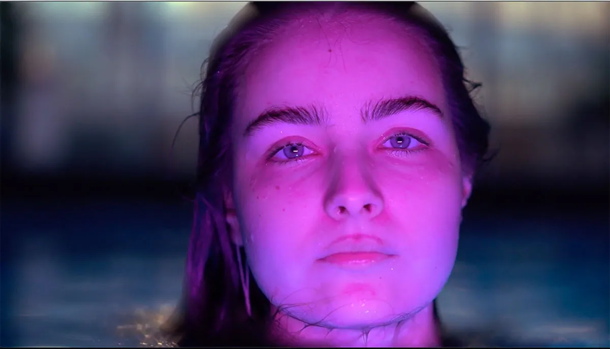 a film still of a woman swimming