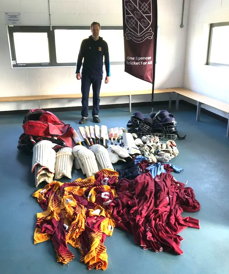 Jamie Greig, SCC Managing Director, with cricket gear donations