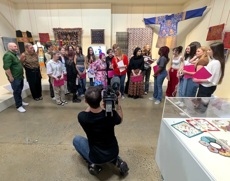 Zandra Rhodes surprising pupils at The London Fashion and Textiles Museum, for BBC's The One Show
