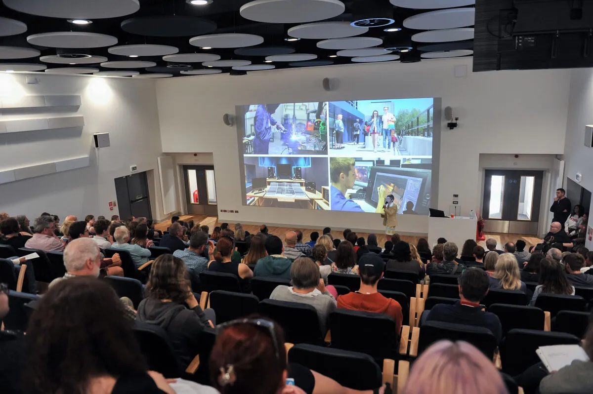 Open Day attendees listening to a presentation in a lecture theatre