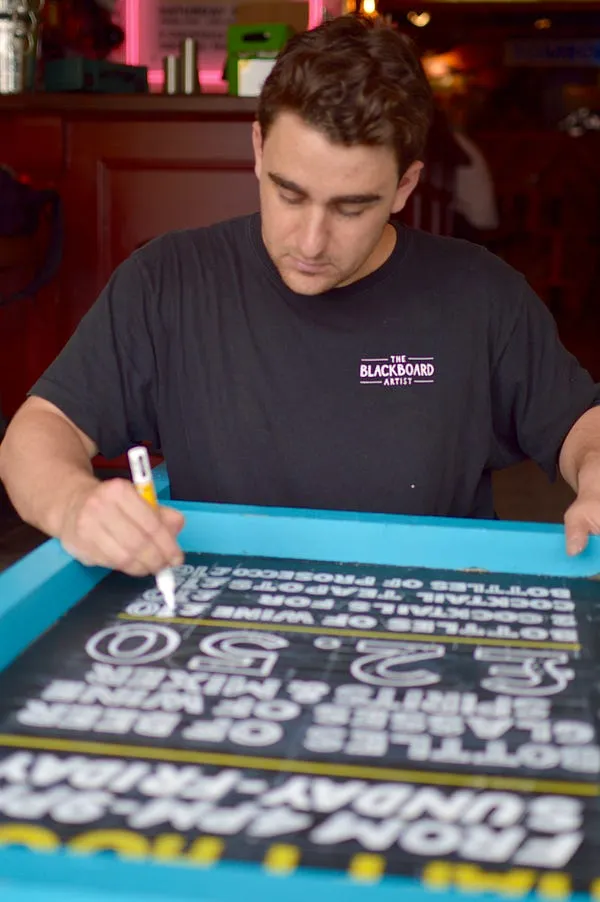 Michael Tilley drawing on a blackboard