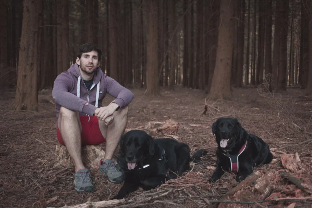 Technical Tutor Adam Thomas with his dogs