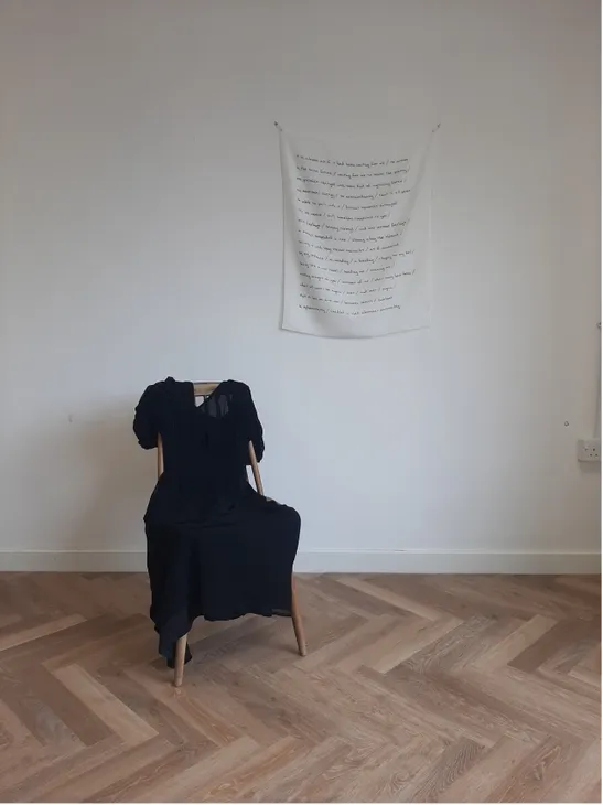 Installation with dress and poem