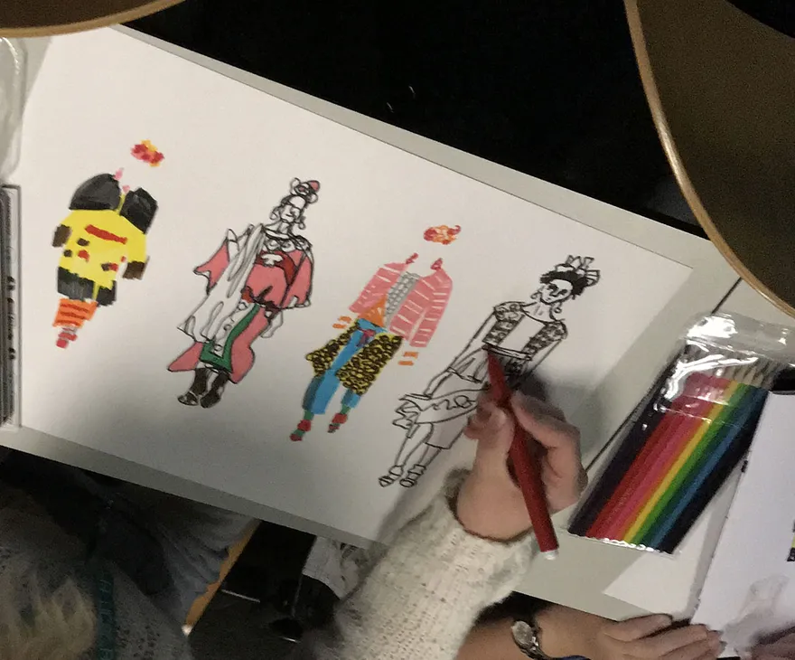 Student drawing fashion illustrations