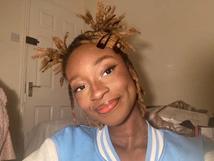 A picture of Illustration student Promise Oladimeji, who is smiling