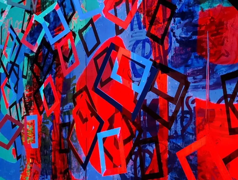 A vibrant piece of art by Vicki Salmi, comprising abstract shapes in red and blue