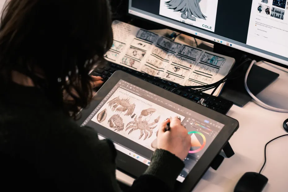 Student working on concept art in a games studio