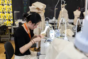 A student working in a fashion studio