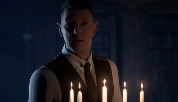 Image from the game House of Ashes showing a shady character (male) lit by candlelight