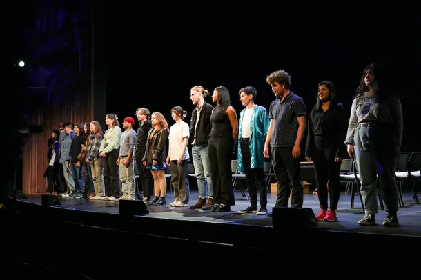 A group of acting students on stage at Bloomsbury Theatre