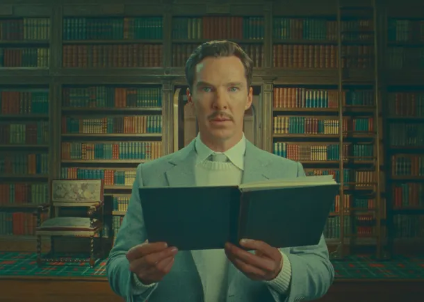 Netflix still of The Wonderful Story of Henry Sugar, showing the titular character (played by Benedict Cumberbatch) holding a book