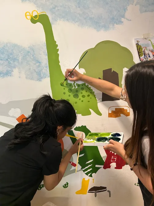 Mural designed by UCA MA Illustration stuents for Shooting Star Children's Hsopice in Guildford