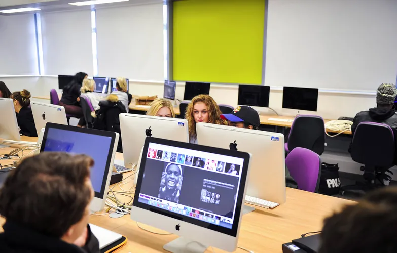 Students studying in Mac suite