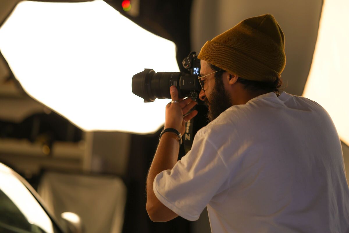 Photographer taking a shot in a UCA studio